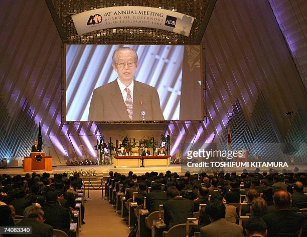 Japanese finance minister and the chairman of the board of the Asian Development Bank , Koji Omi , delivers an address in the opening session of...