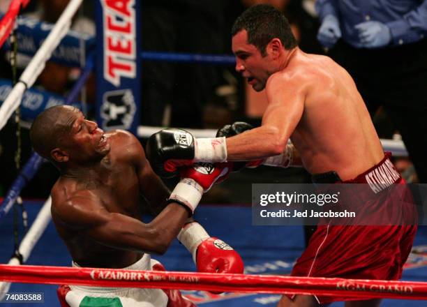 Oscar De La Hoya throws a left at Floyd Mayweather Jr. During their WBC super welterweight world championship fight at the MGM Grand Garden Arena May...