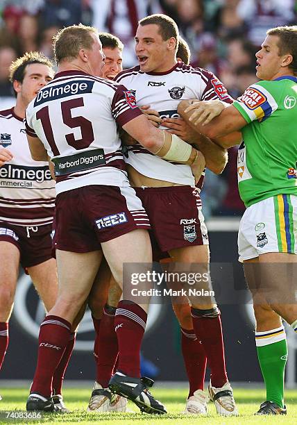 Anthony Watmough of Manly celebrates his try with team mates during the round eight NRL match between the Canberra Raiders and the Manly Warringah...