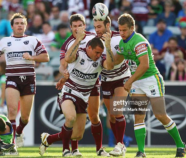 Anthony Watmough of Manly celebrates his try with team mates during the round eight NRL match between the Canberra Raiders and the Manly Warringah...