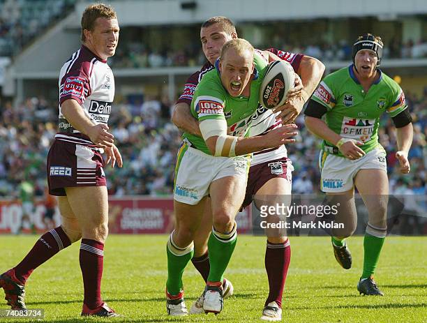Michael Dobson of the Raiders heads for the try line during the round eight NRL match between the Canberra Raiders and the Manly Warringah Sea Eagles...