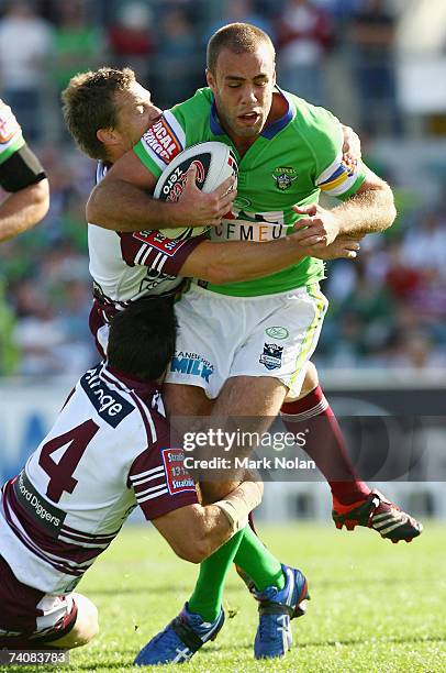 Adrian Purtell of the Raiders is tackled during the round eight NRL match between the Canberra Raiders and the Manly Warringah Sea Eagles at Canberra...