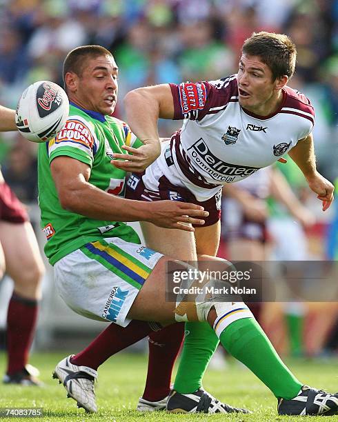 Tom Learoyd-Lahrs of the Raiders tackles Matt Ballin of Manly as he offloads during the round eight NRL match between the Canberra Raiders and the...