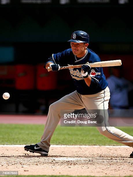 Oscar Robles of the San Diego Padres lays down a sacrifice bunt against the Florida Marlins on May 6, 2007 at Dolphin Stadium in Miami, Florida. The...
