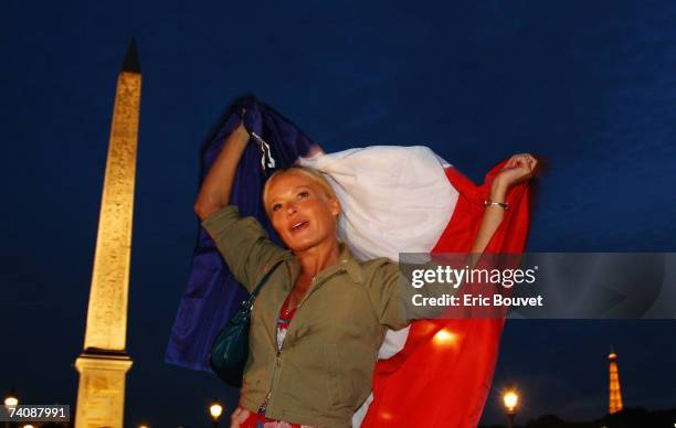 Supporter of conservative UMP Leader and French Presidential candidate Nicolas Sarkozy celebrates victory in the Second Round of the French...