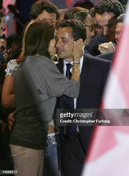 Victorious French Presidential candidate Nicolas Sarkozy kisses his wife Cecilia during a rally at The Place De la concorde on May 6 Paris, France....