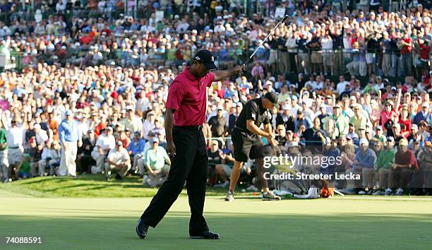 Tiger Woods celebrates after his two-stroke vicotory at the Wachovia Championship at Quail Hollow Club on May 6, 2007 in Charlotte, North Carolina.