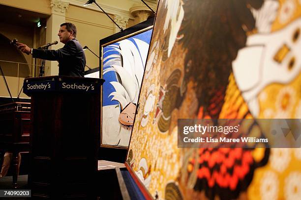 Auctioneer Justin Miller accepts a bid at the Sotheby's auction of important Australian paintings May 7, 2007 in Sydney, Australia.