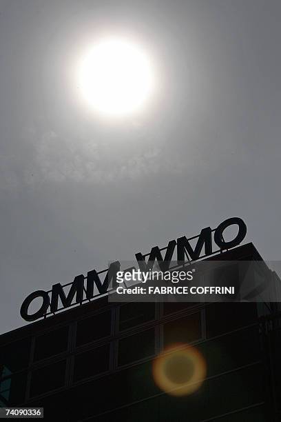 Pale sun rises 07 May 2007 above the headquarters of the World Meteorological Organization in Geneva. The specialized agency of the United Nations...