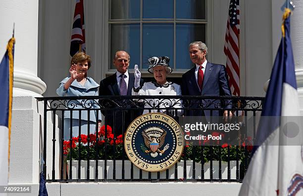 President George W. Bush, Queen Elizabeth II, her husband Prince Philip, the Duke of Edinburgh, and first lady Laura Bush wave to the crowd from the...