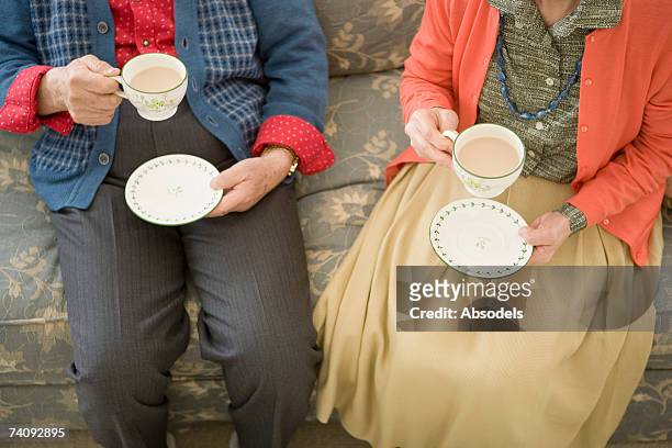 a woman and man having coffee - cup saucer stock pictures, royalty-free photos & images
