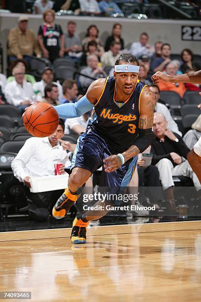 Allen Iverson of the Denver Nuggets drives to the basket in Game Two of the Western Conference Quarterfinals against the San Antonio Spurs during the...