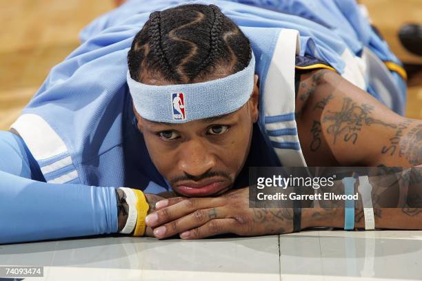 Allen Iverson of the Denver Nuggets lays on the court before the start of Game Two of the Western Conference Quarterfinals against the San Antonio...