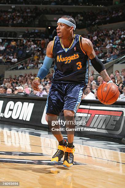 Allen Iverson of the Denver Nuggets controls the ball in Game Two of the Western Conference Quarterfinals against the San Antonio Spurs during the...