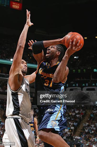 Nene of the Denver Nuggets goes up for a shot over Tim Duncan of the San Antonio Spurs in Game Two of the Western Conference Quarterfinals during the...