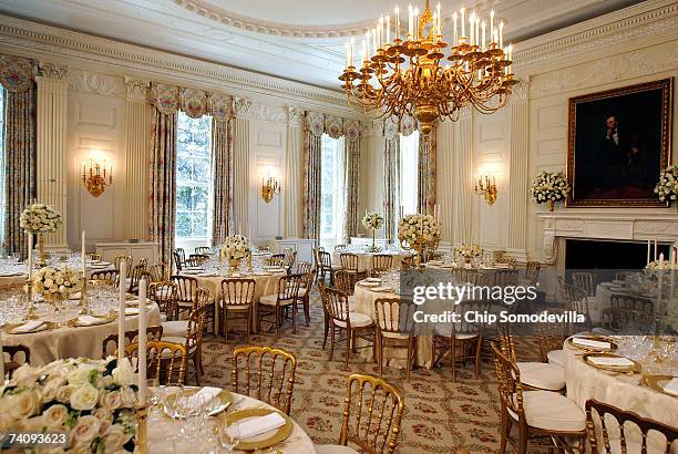 The State Dining room on the State Floor of the White House is set for the dinner honoring Queen Elizabeth II May 7, 2007 in Washington, DC. Thirteen...