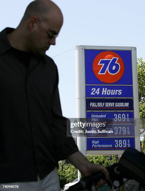 Customer pumps gasoline into his car at a service station May 7, 2007 in San Francisco, California. Gas prices reached a record national average...