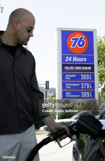 Customer pumps gasoline into his car at a service station May 7, 2007 in San Francisco, California. Gas prices reached a record national average...