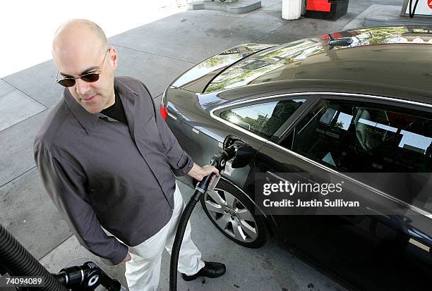 Customer pumps gasoline into his car at a service station May 7, 2007 in San Francisco, California. Gas prices reached a record national average...