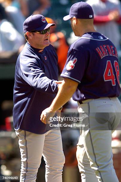 Manager Eric Wedge congratulates Travis Hafner of the Cleveland Indians after the game against the Baltimore Orioles on May 7, 2007 at Oriole Park at...