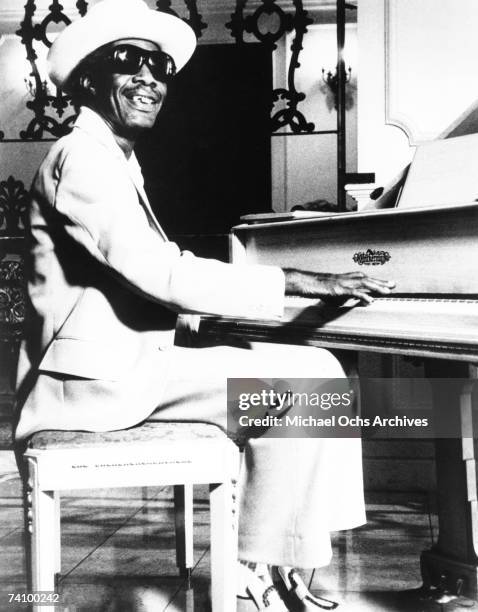 Blues pianist Professor Longhair poses for a circa early 1970s portrait playing a piano.