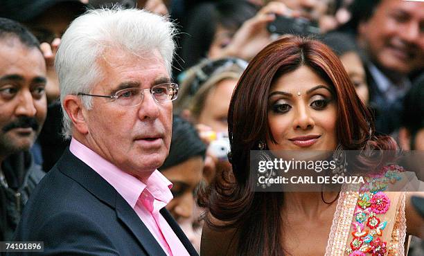 London, UNITED KINGDOM: Indian actress Shilpa Shetty and British publicist Max Clifford pose as they arrive for the premiere of the film 'Life in.......