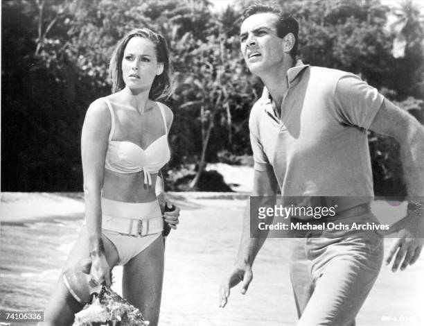Actors Ursula Andress and Sean Connery in a scene from 'Dr. No" directed by Terence Young.