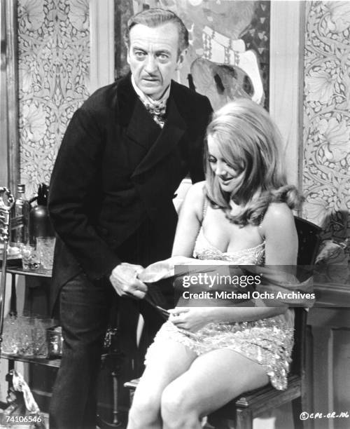 Actors David Niven and Ursula Andress in scene from James Bond spoof "Casino Royale" directed by Ken Hughes and John Huston.