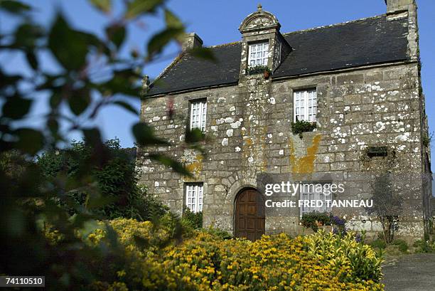 Don't rush!+ The art of Breton building, old-style". Picture taken 03 May 2007 in Locronan, Brittany, of a house build in 1693. Brittany, with its...