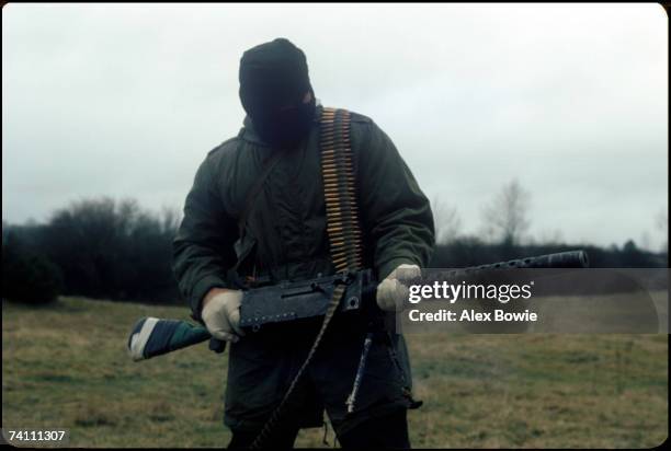 An IRA gunman with a World War II vintage machine gun during a training and propaganda exercise in Northern Ireland, 12th February 1977.