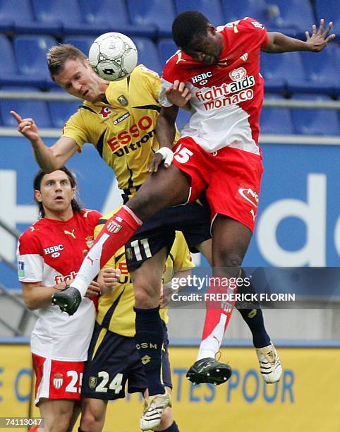 Sochaux's midfielder Philippe Brunel and Monaco's forward Yaya Toure fight for the ball during their French L1 football match Sochaux vs. Monaco, 09...