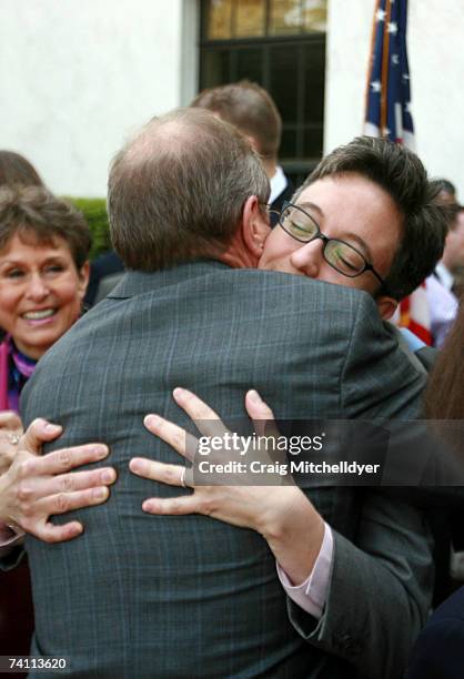 Oregon's Democratic Governor Ted Kulongoski hugs lesbian state Rep. Tina Kotek after signing two bills protecting gay rights into law at the Oregon...