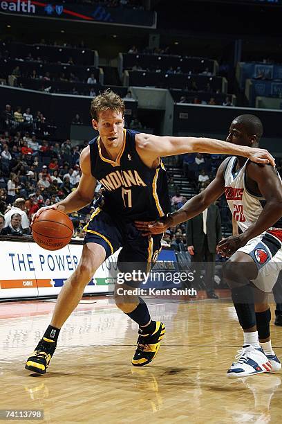 Mike Dunleavy of the Indiana Pacers drives around Raymond Felton of the Charlotte Bobcats on April 6, 2007 at Charlotte Bobcats Arena in Charlotte,...