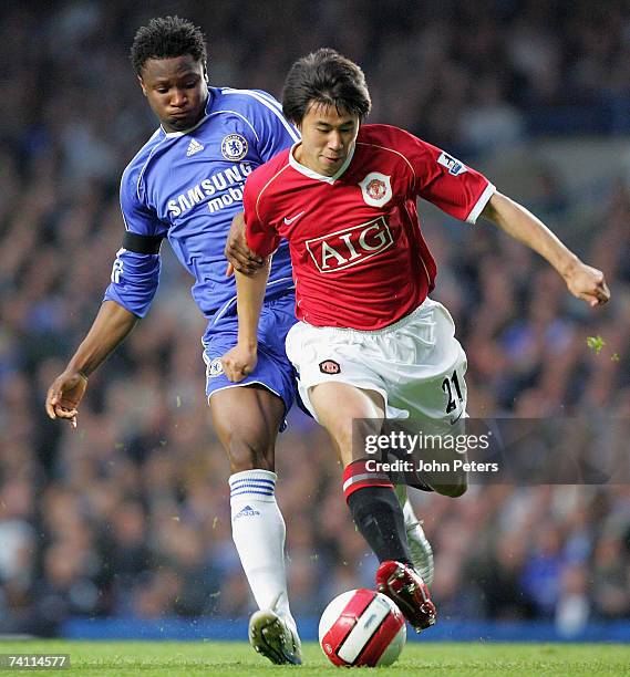 Dong Fangzhuo of Manchester United clashes with John Obi Mikel of Chelsea during the Barclays Premiership match between Chelsea and Manchester United...