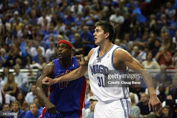 Darko Milicic of the Orlando Magic and Chris Webber of the Detroit Pistons battle for position in Game Four of the Eastern Conference Quarterfinals...