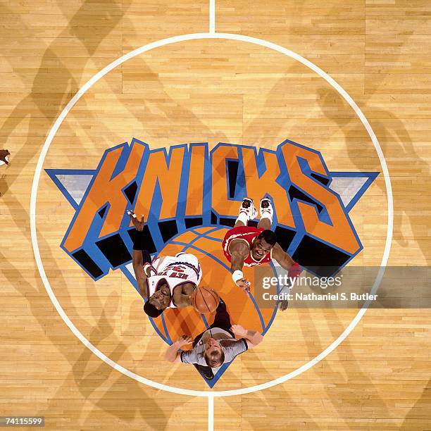 Patrick Ewing of the New York Knicks and Hakeem Olajuwon of the Houston Rockets jump for the tip off during Game Four of the NBA Finals played on...