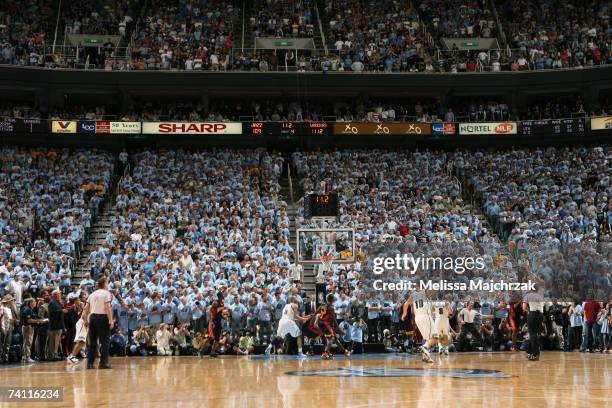 Mehmet Okur of the Utah Jazz makes the shot to put the Jazz behind the Golden State Warriors by one point in Game Two of the Western Conference...