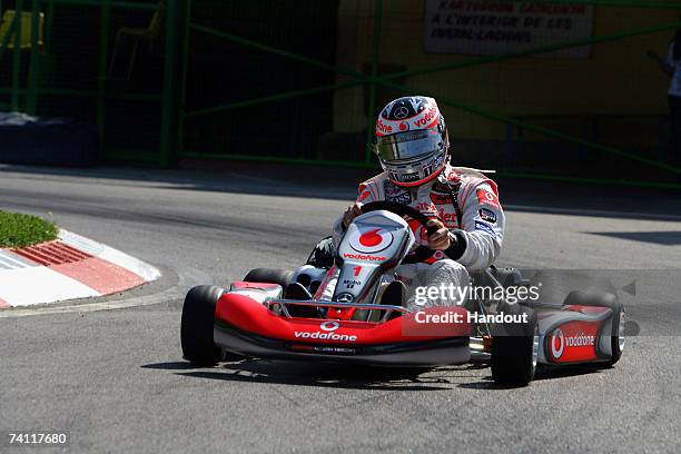 In this handout photograph provided by Vodafone, Fernando Alonso in action during the Vodafone Go-Karting Challenge prior to the Spanish Grand Prix...