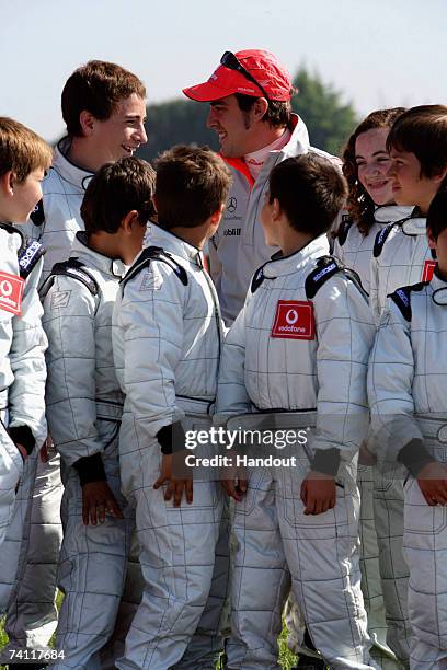 In this handout photograph provided by Vodafone, Fernando Alonso and friends during the Vodafone Go-Karting Challenge prior to the Spanish Grand Prix...