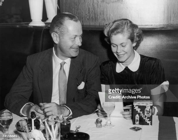 American actor Robert Montgomery dines with his daughter, actress Elizabeth Montgomery , at the Stork Club in New York City, circa 1955.