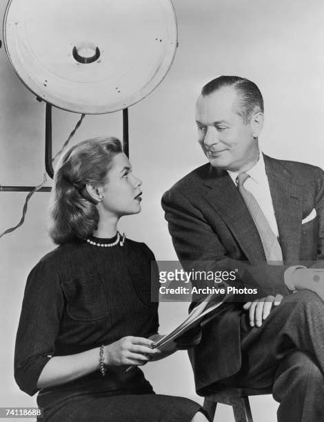 American actor Robert Montgomery on a film set with his daughter, actress Elizabeth Montgomery , circa 1960.