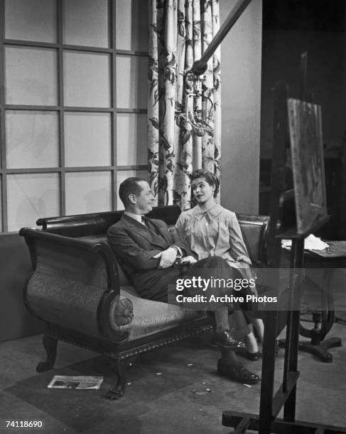 American actor Robert Montgomery on a film set with his daughter, actress Elizabeth Montgomery , circa 1955.