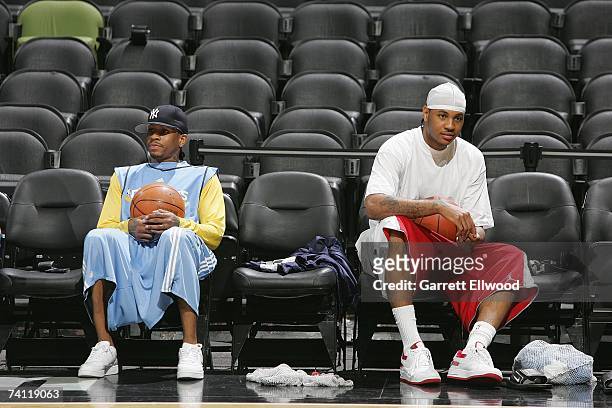 Allen Iverson and Carmelo Anthony of the Denver Nuggets sit on the sideline during practice for the Western Conference Quarterfinals against the San...