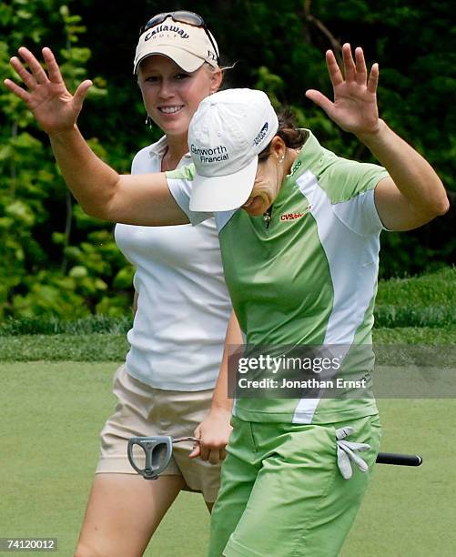 Juli Inkster acknowledges the crowd after hitting a hole-in-one on the 13th hole in Round 1 of the LPGA Michelob Ultra Open at Kingsmill May 10 in...