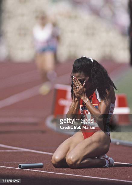 Florence Griffith-Joyner of the United States celebrates second place and the silver medal in the Women's 4 x 400metres final event during the XXIV...