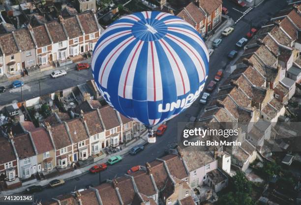 The Unipart hot air balloon makes a pass over the Ashton Court Estate during the Bristol International Balloon Fiesta on 15 August 1990 in Bristol,...