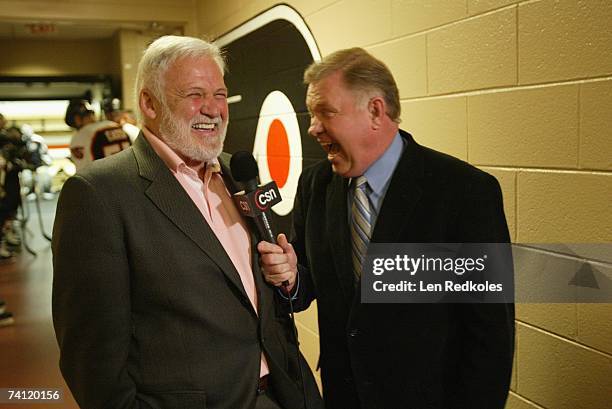 Bernie Parent is interviewed by Flyers broadcaster Steve Coates prior to the game between the Philadelphia Flyers and the New Jersey Devils at...