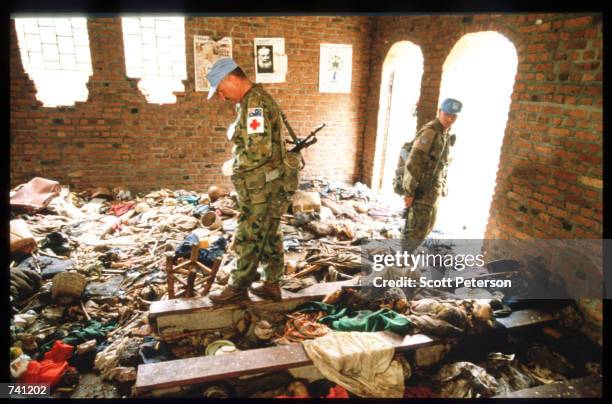 United Nations investigators survey the scene September 16, 1994 at a church in Ntarama, Rwanda. The bodies of four hundred Tutsis murdered by Hutu...