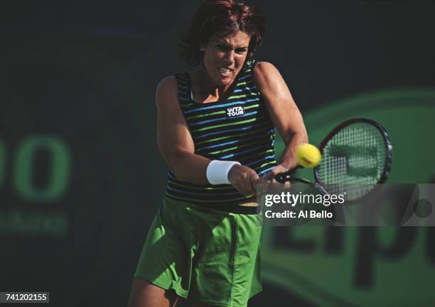 Jennifer Capriati of the United States eyes the ball for a double back hand return against Silvija Talaja during their Women's Singles first round...
