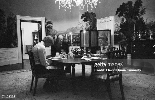 President Gerald R. Ford, First Lady Betty Ford and son Steven Ford say grace prior to eating dinner in the President's dining room on the second...